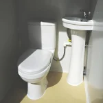 Bastone Portable Restroom w/ Sink, Flush Toilet & Vent Fan for Outdoor Use